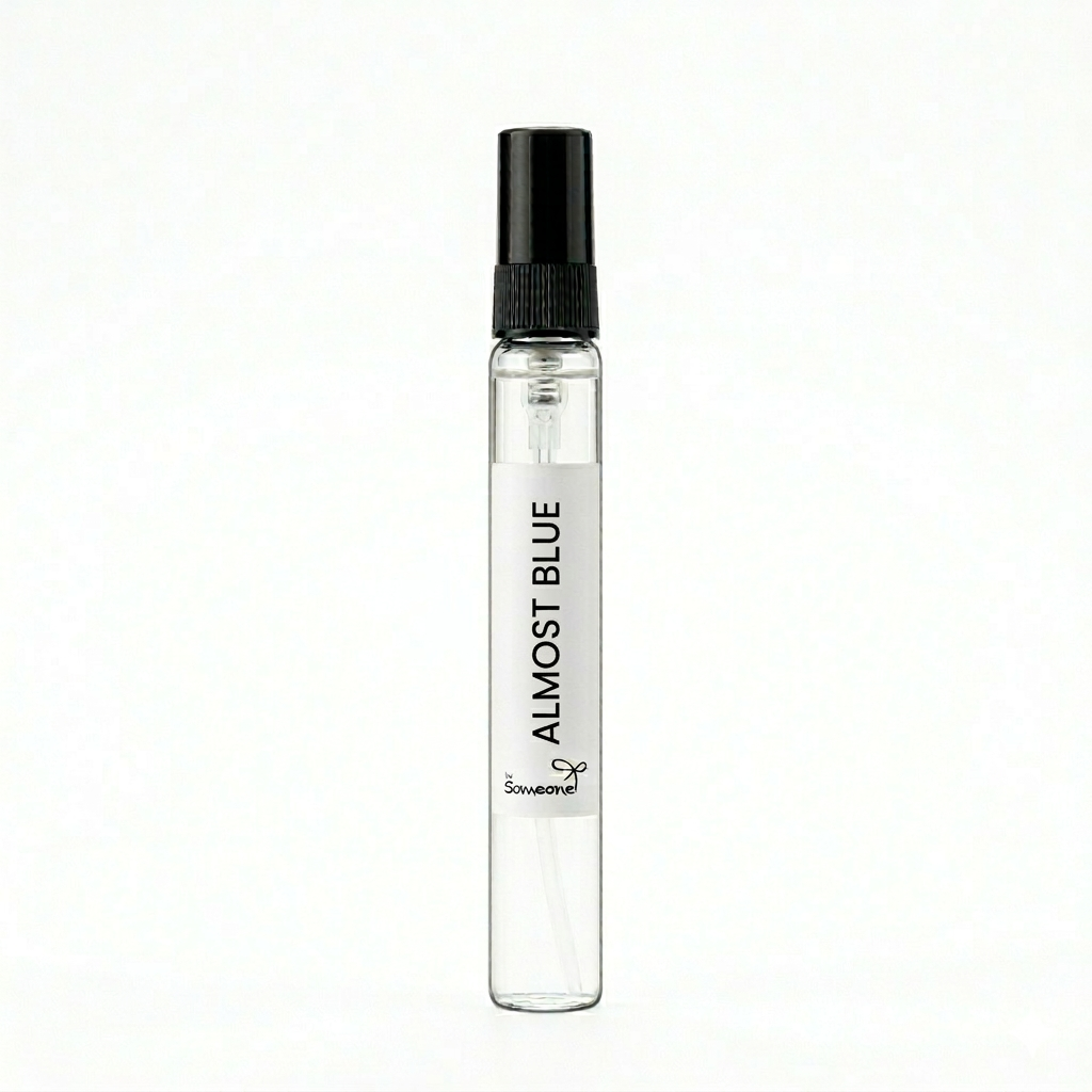 Small clear spray bottle labeled 'Almost Blue' on a white background